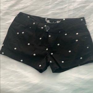 Black shorts with white polka dots